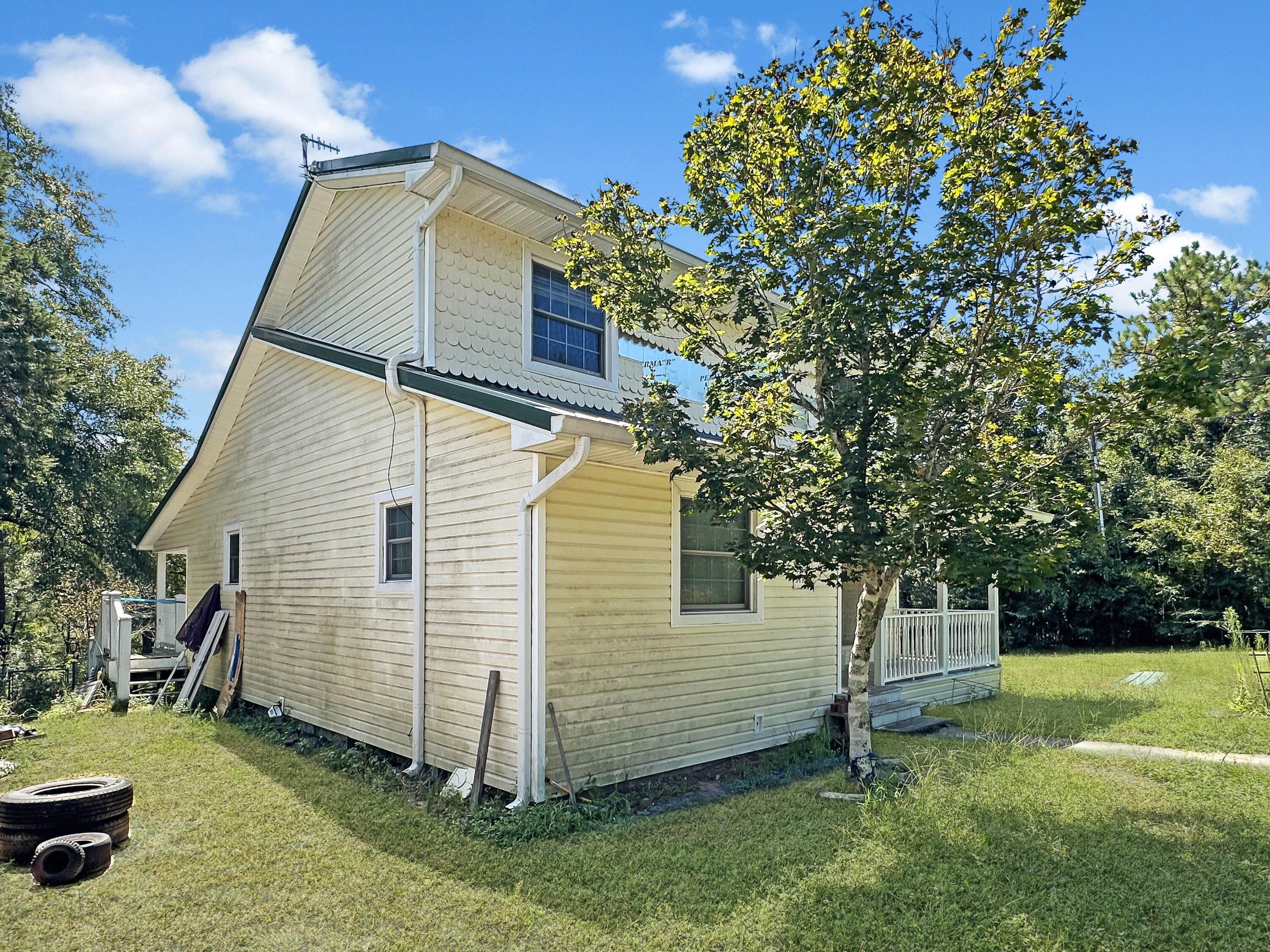 6119 Clear Creek Road Crestview, FL 32539 - Photo 12 of 46 a view of a backyard with a garden