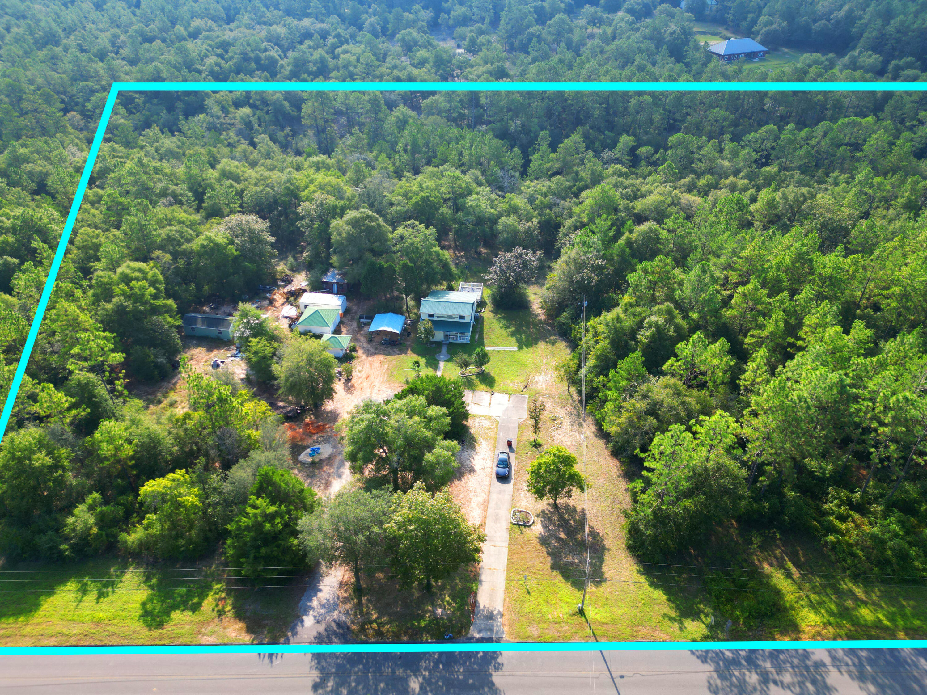6119 Clear Creek Road Crestview, FL 32539 - Photo 18 of 46 a view of a yard with plants