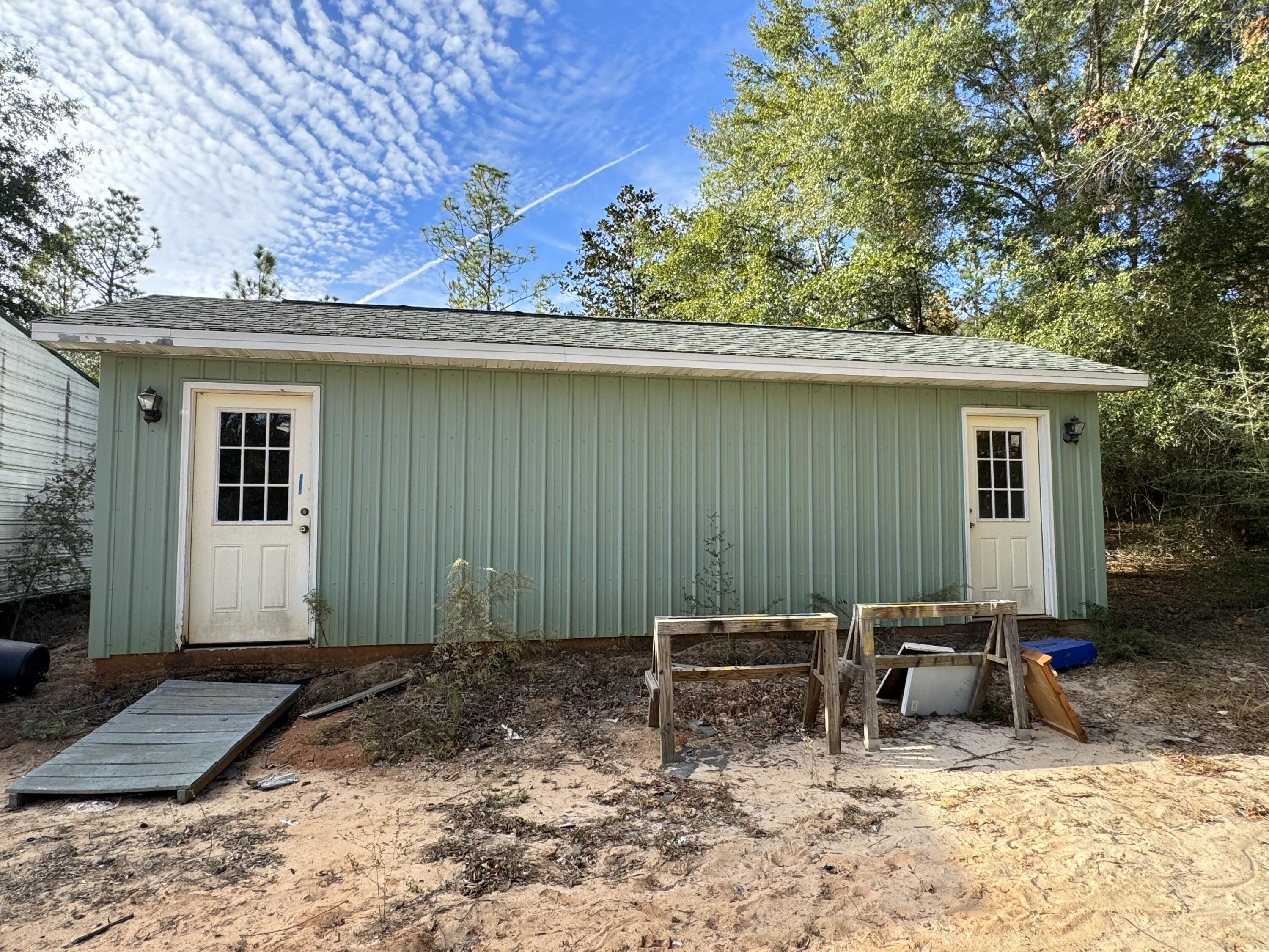 6119 Clear Creek Road Crestview, FL 32539 - Photo 27 of 46 a backyard of a house with table and chairs