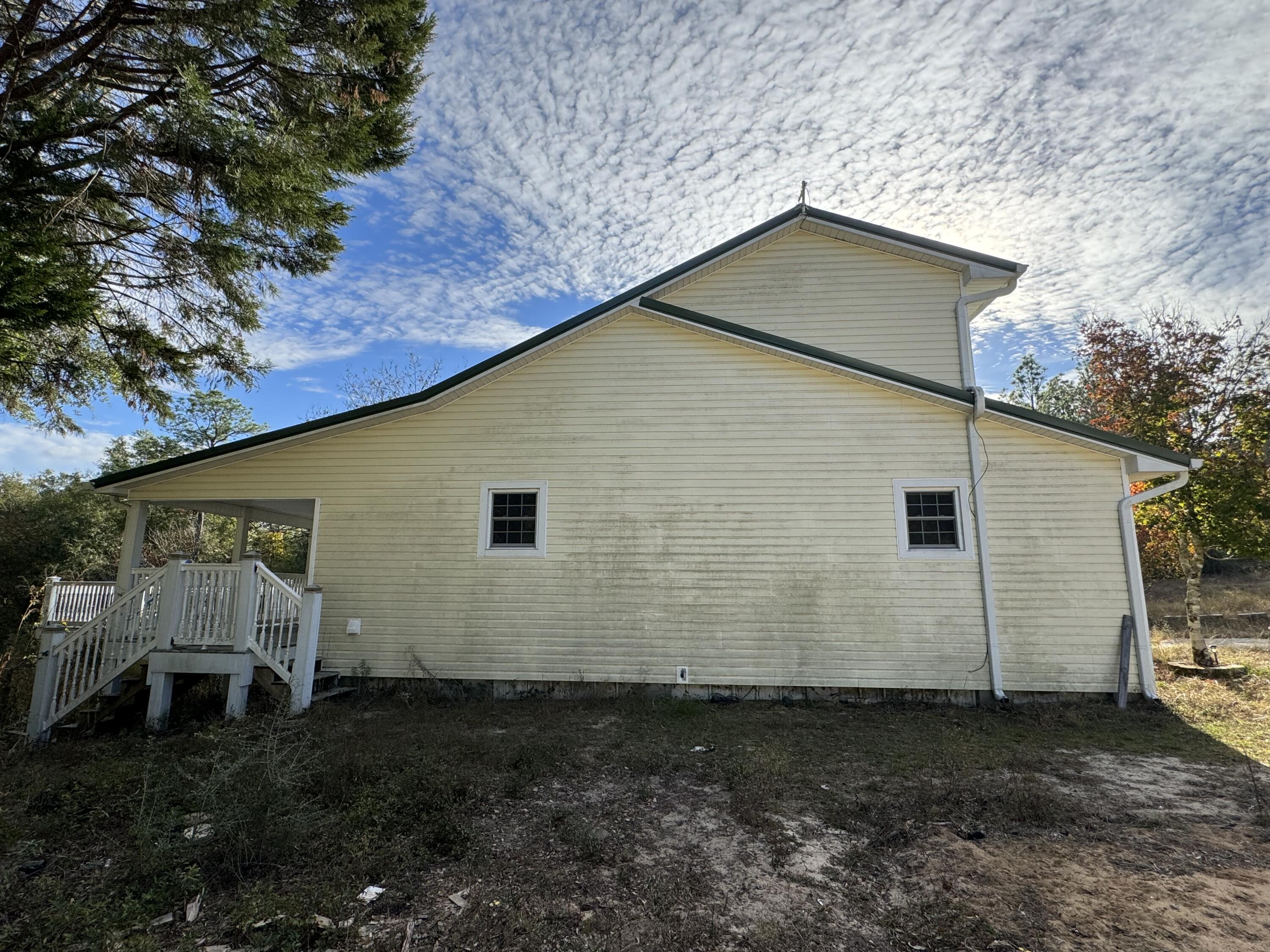 6119 Clear Creek Road Crestview, FL 32539 - Photo 29 of 46 a backyard of a house with lots of green space