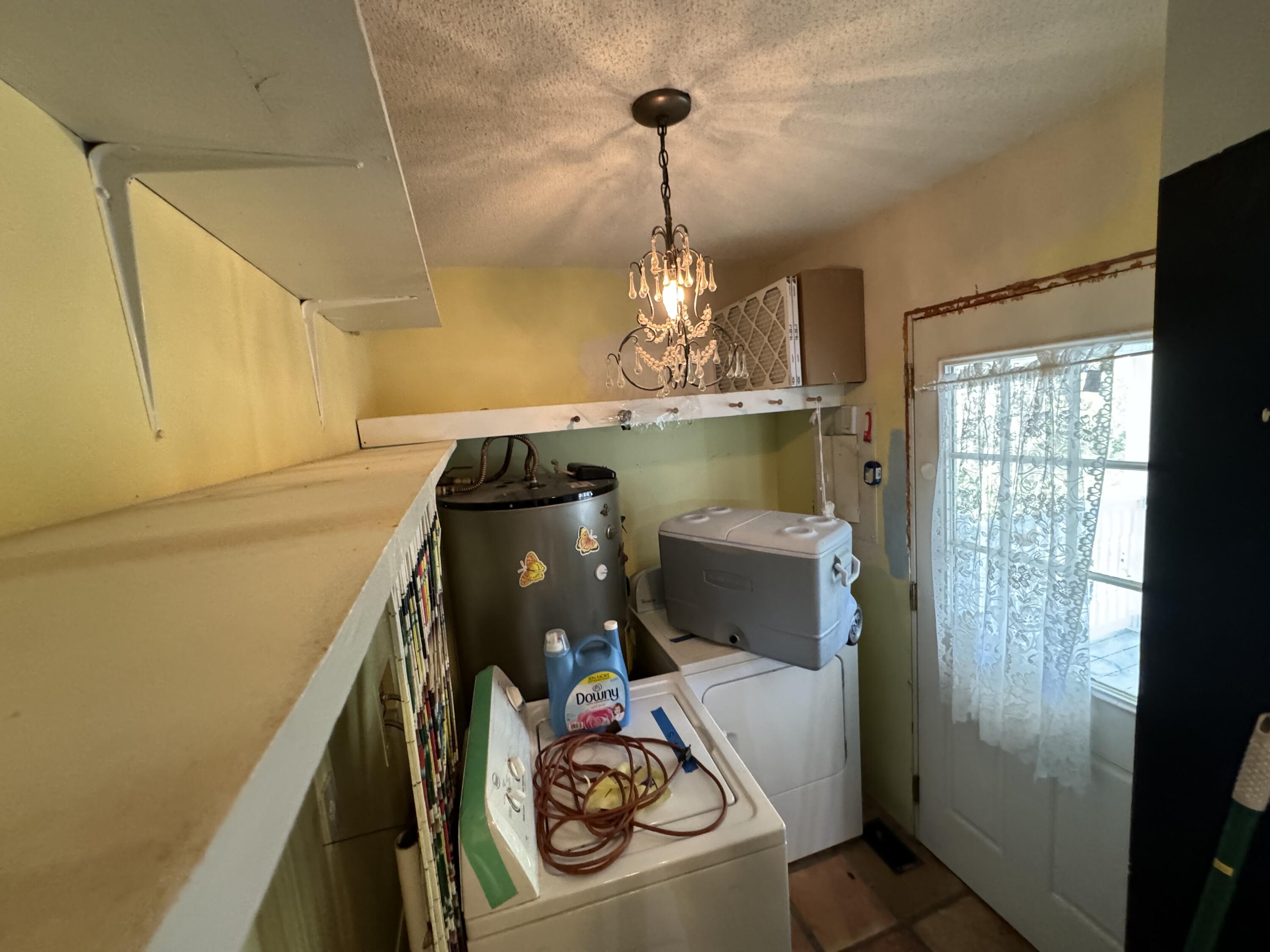 6119 Clear Creek Road Crestview, FL 32539 - Photo 34 of 46 a utility room with dryer and washer