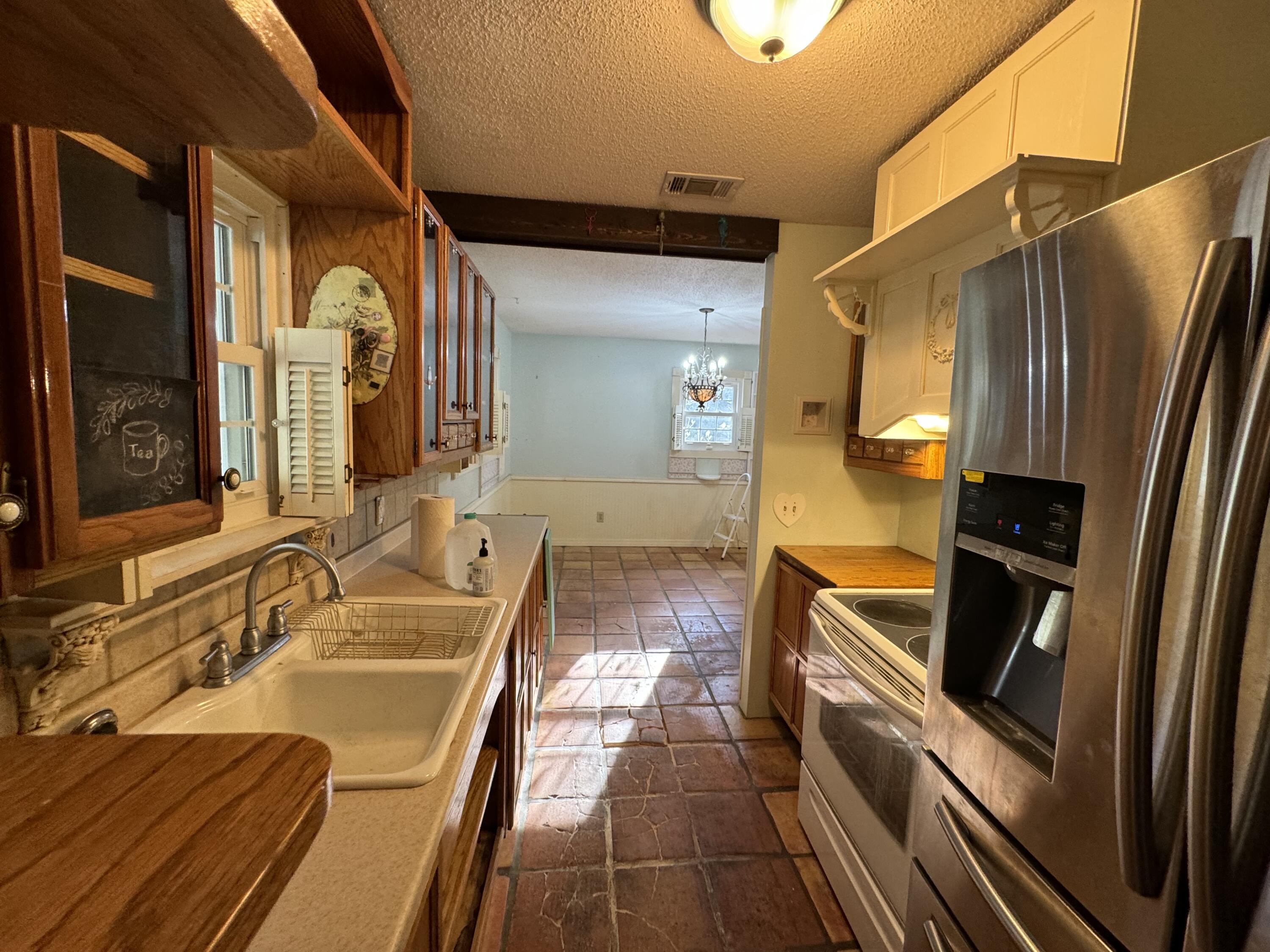 6119 Clear Creek Road Crestview, FL 32539 - Photo 35 of 46 a bathroom with a sink a mirror and a bathtub