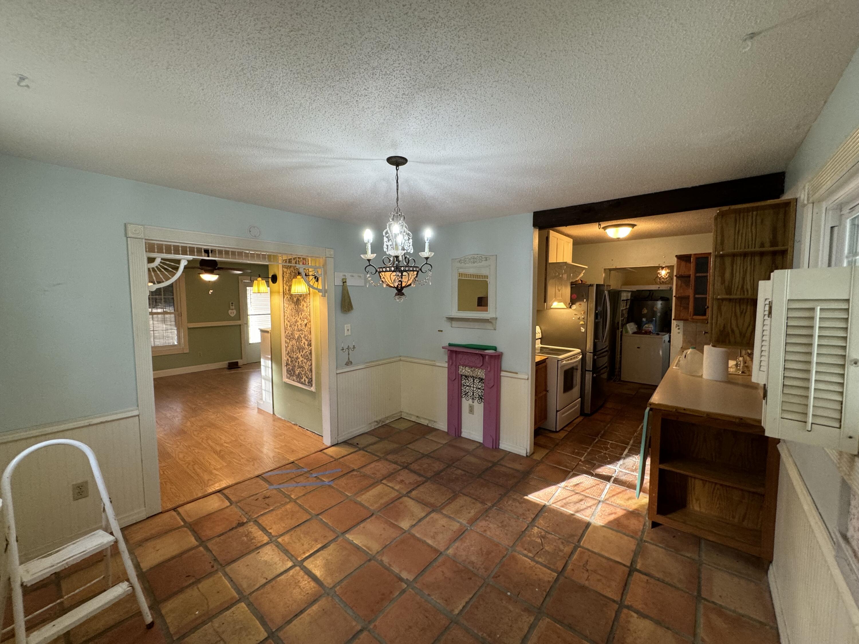 6119 Clear Creek Road Crestview, FL 32539 - Photo 37 of 46 a lobby with furniture and a chandelier