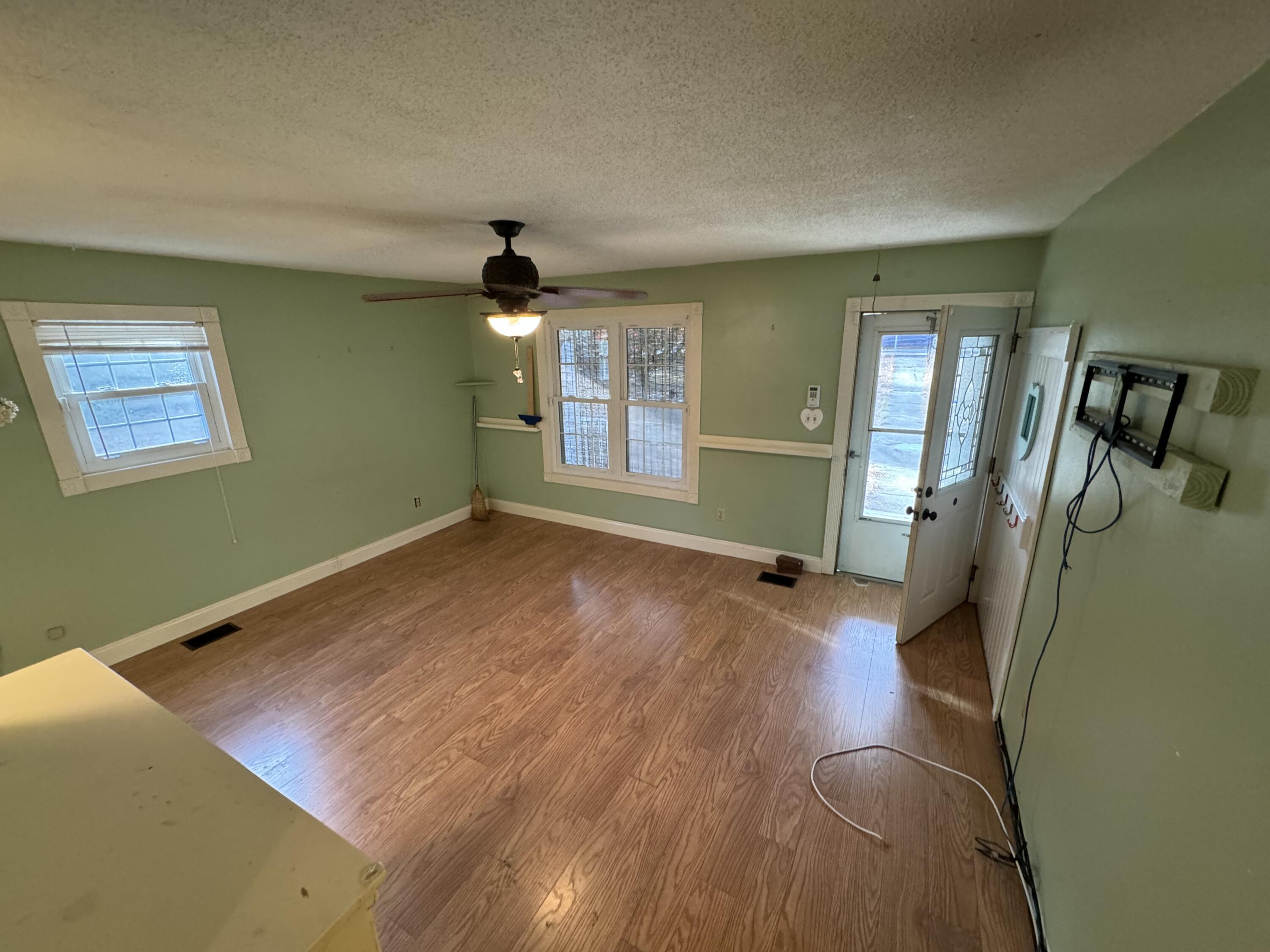 6119 Clear Creek Road Crestview, FL 32539 - Photo 43 of 46 wooden floor in an empty room with a window