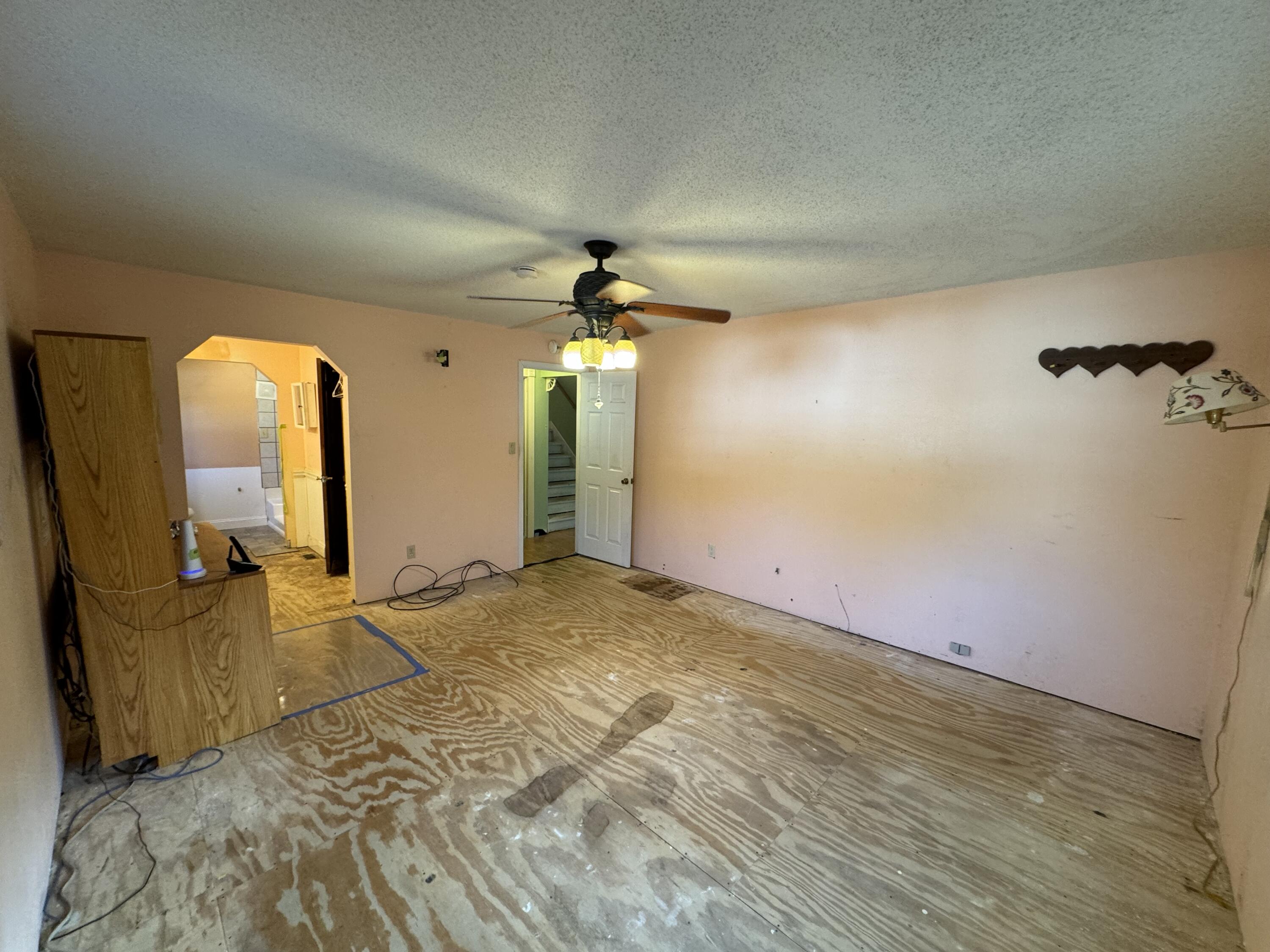 6119 Clear Creek Road Crestview, FL 32539 - Photo 6 of 46 a view of a livingroom with a staircase