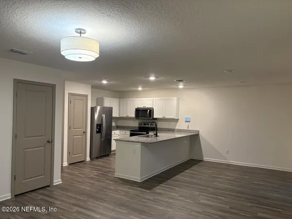 a bathroom with a double vanity sink and mirror