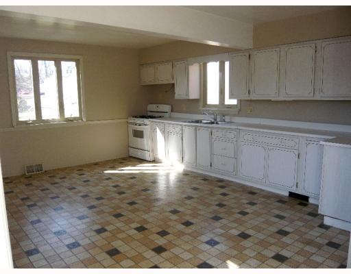 Kitchen. Spacious kitchen with door to side deck