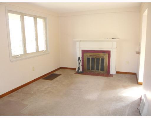 Living Room. A log burning fireplace is the focal point of the living room