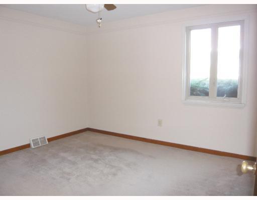 Master Bedroom. Master features ceiling fan and neutral paint.