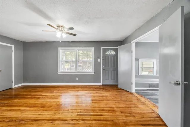 a view of an empty room with a window