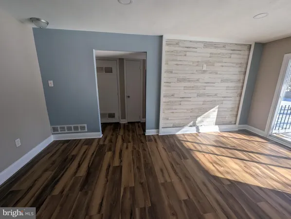 a view of wooden floor in an empty room