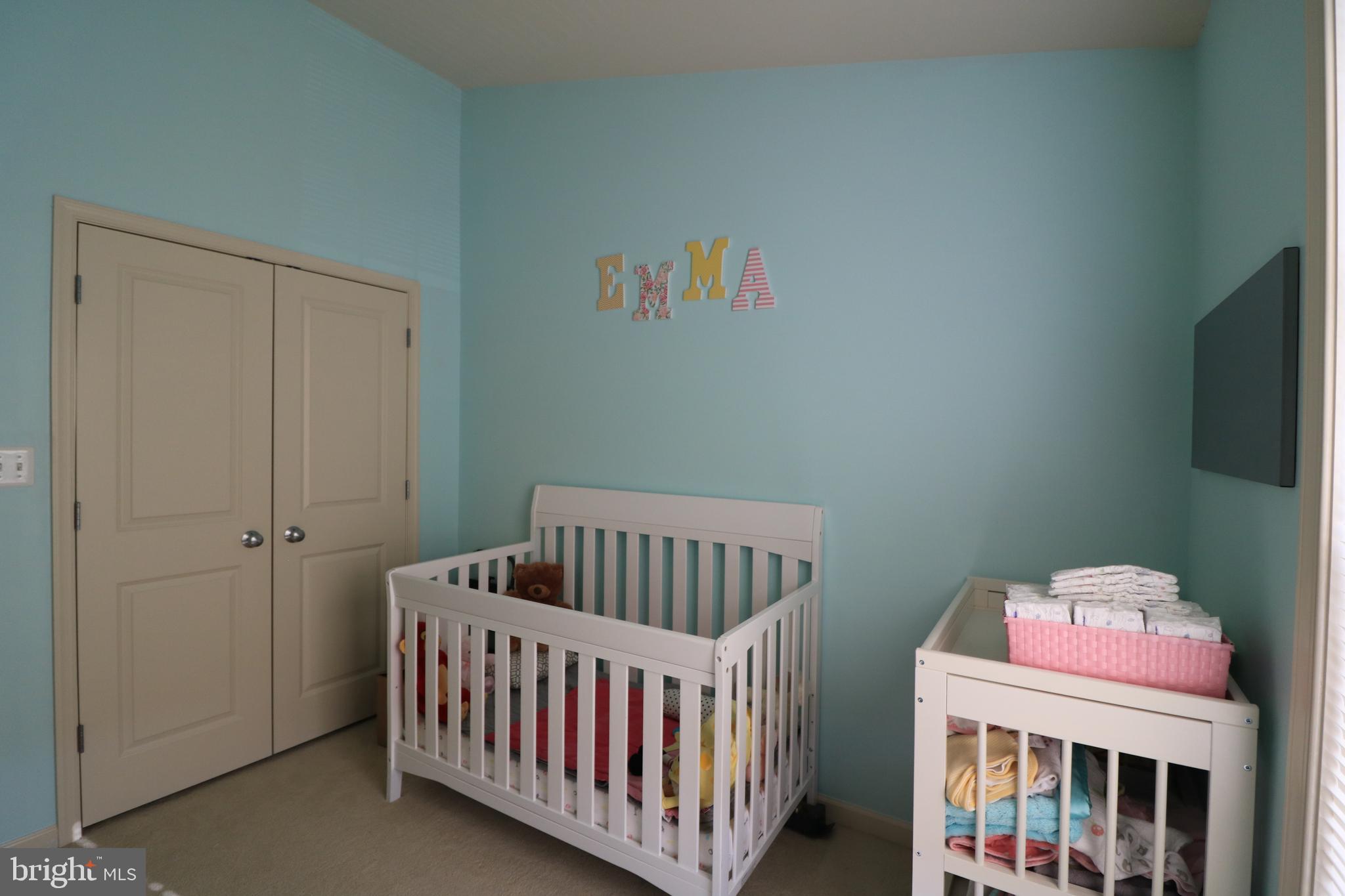 13411 Deer Highlands Way Silver Spring, MD 20906 - Photo 13 of 32 a bedroom with furniture and a baby crib