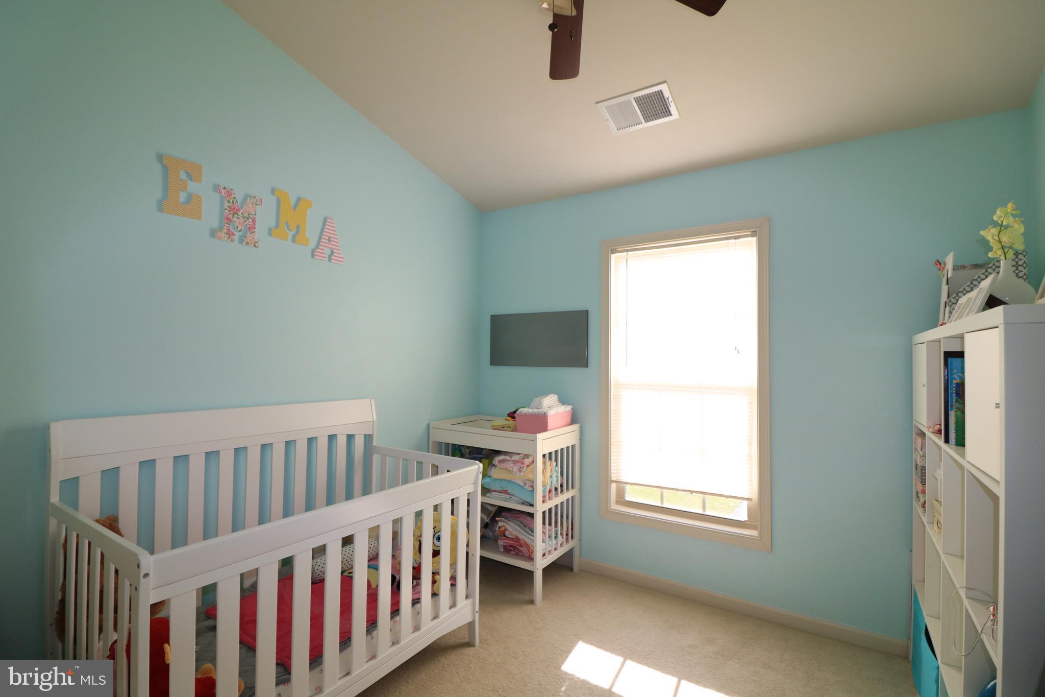 13411 Deer Highlands Way Silver Spring, MD 20906 - Photo 18 of 32 a bedroom with furniture and a window