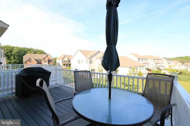 a view of a balcony with furniture