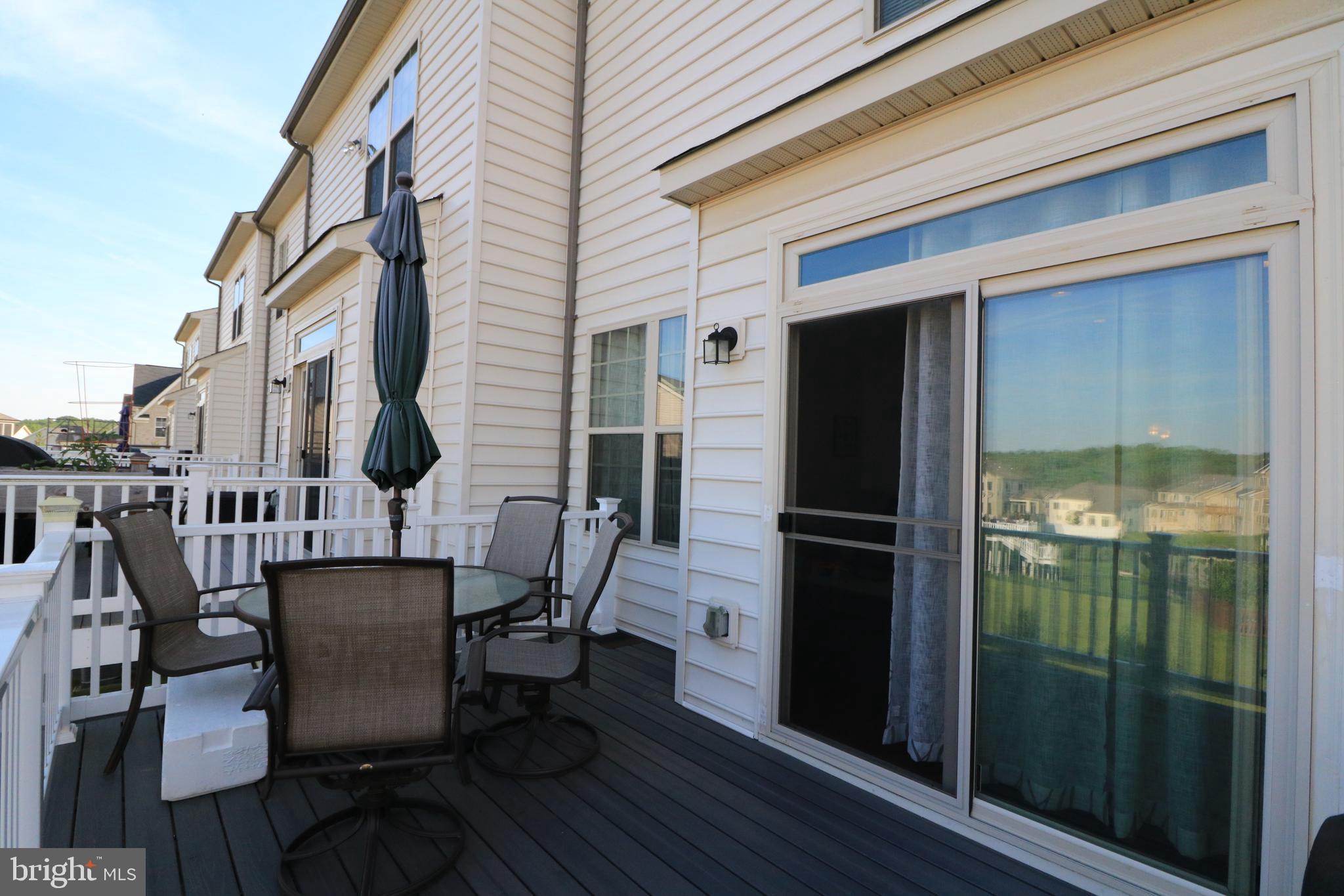 13411 Deer Highlands Way Silver Spring, MD 20906 - Photo 23 of 32 a view of a chairs and table in the balcony