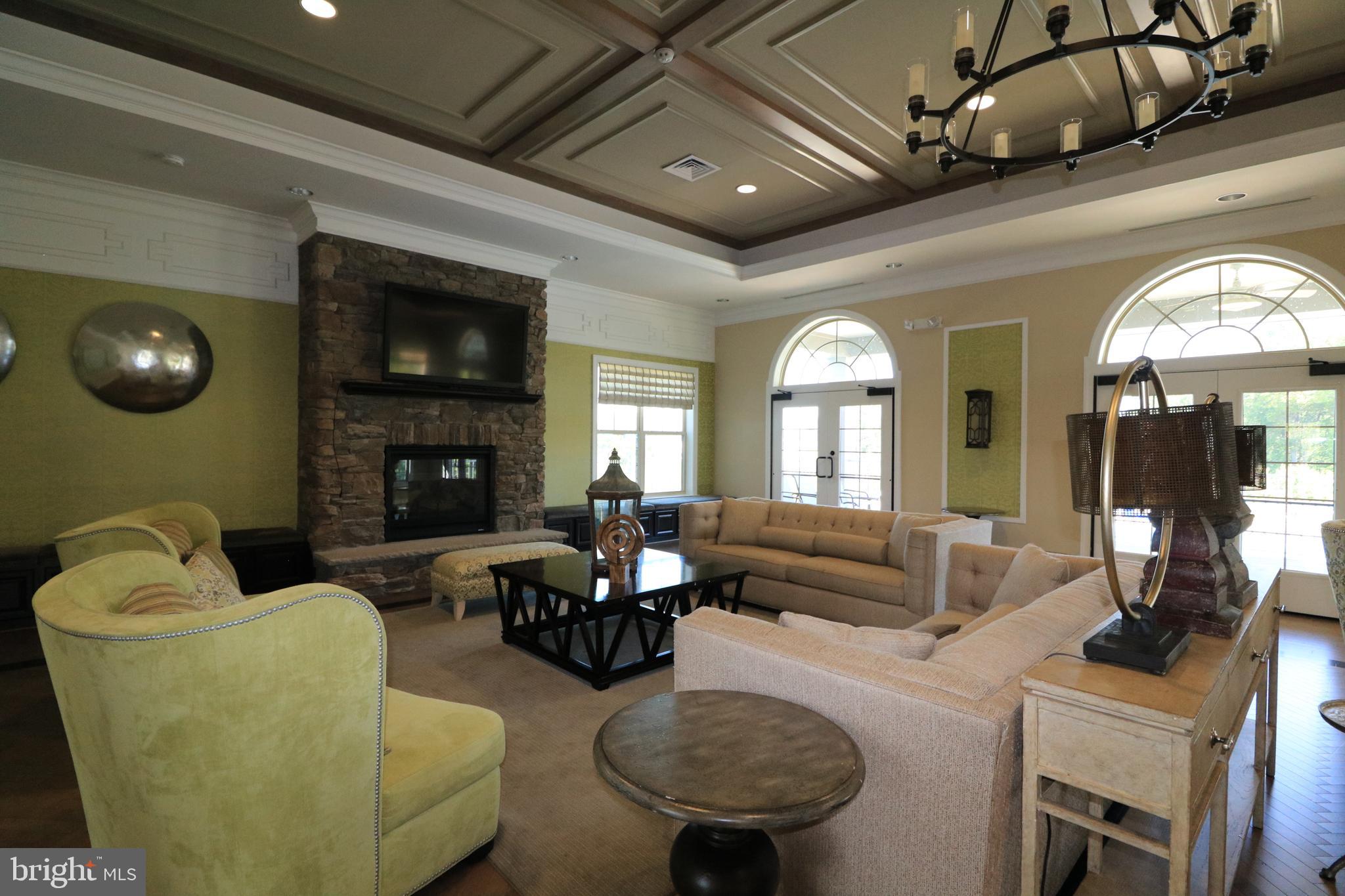 13411 Deer Highlands Way Silver Spring, MD 20906 - Photo 29 of 32 a living room with furniture and a fireplace