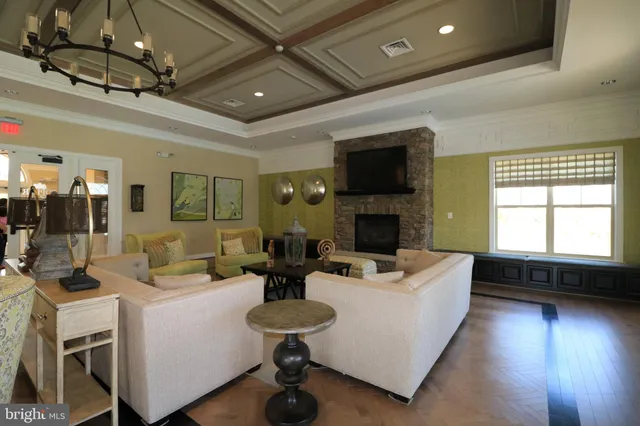 a living room with fireplace furniture and a flat screen tv
