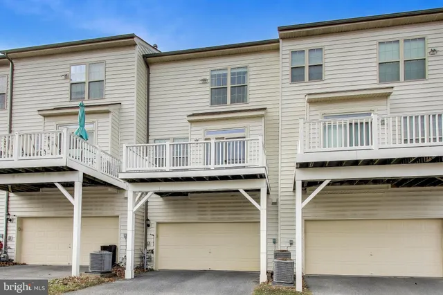 a front view of a house with a garage