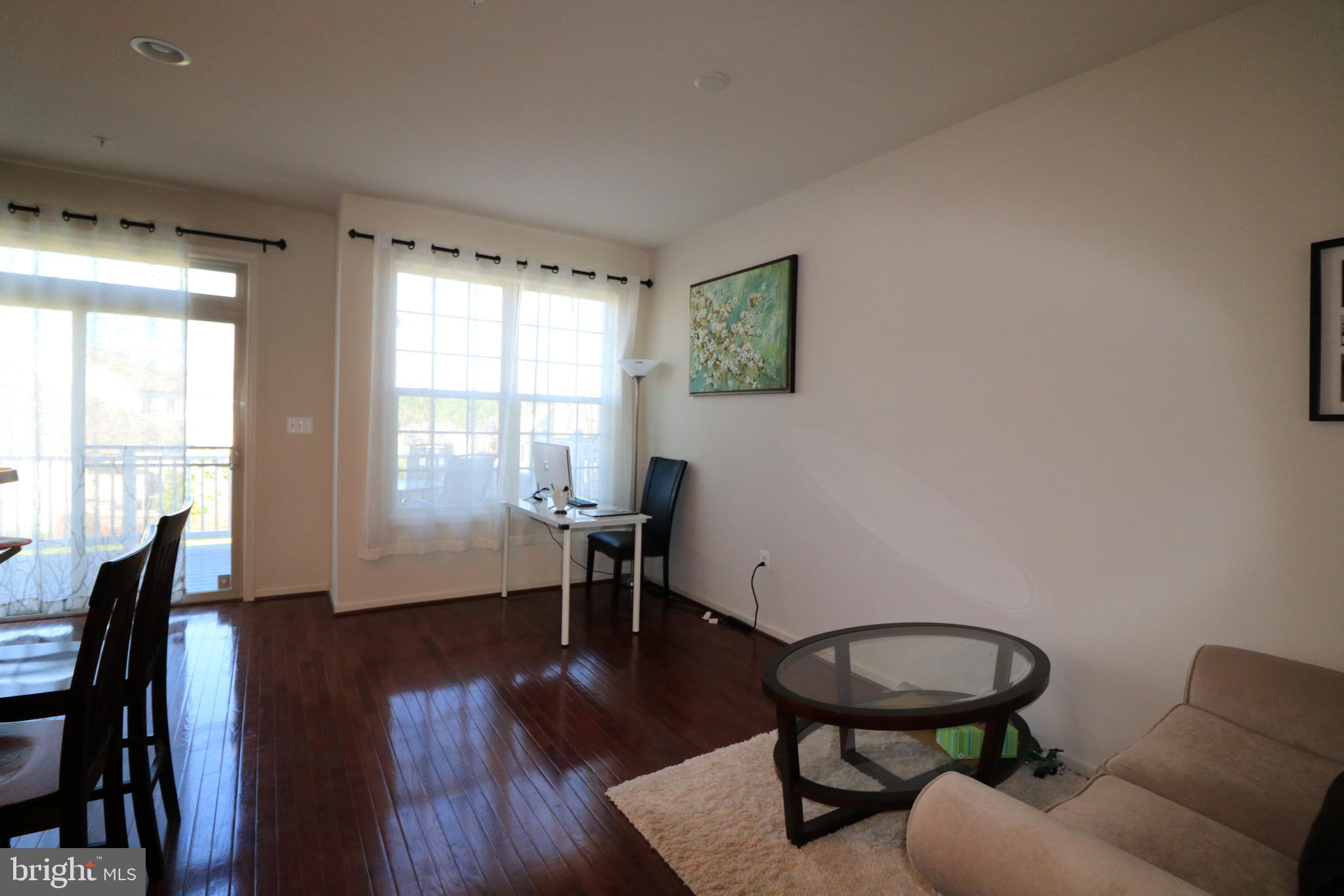 13411 Deer Highlands Way Silver Spring, MD 20906 - Photo 4 of 32 a living room with furniture and a window