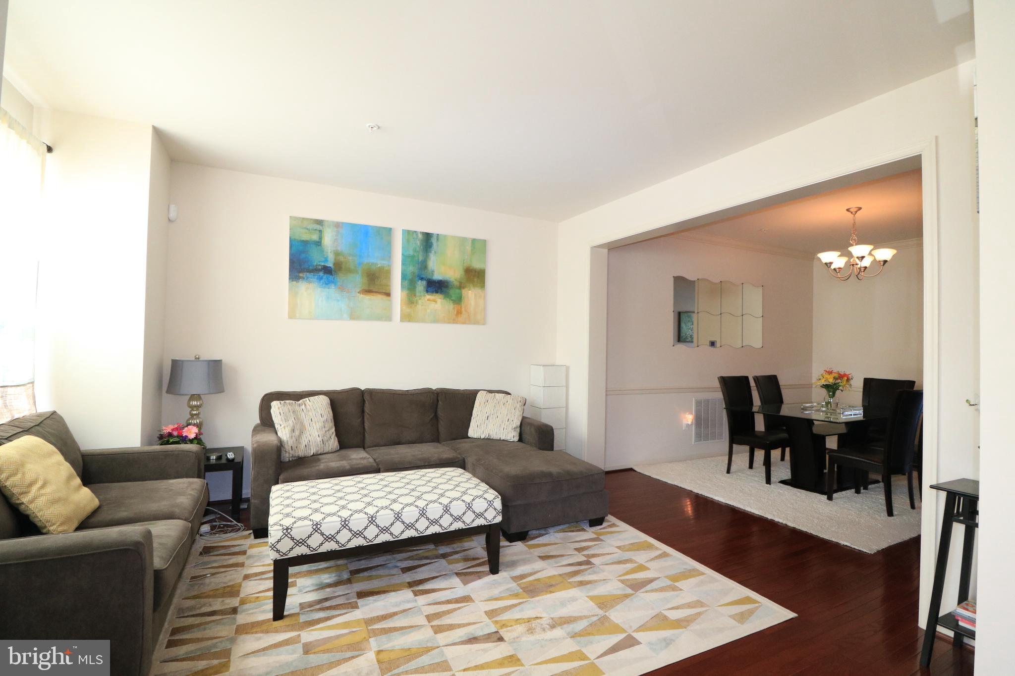 13411 Deer Highlands Way Silver Spring, MD 20906 - Photo 8 of 32 a living room with furniture and wooden floor
