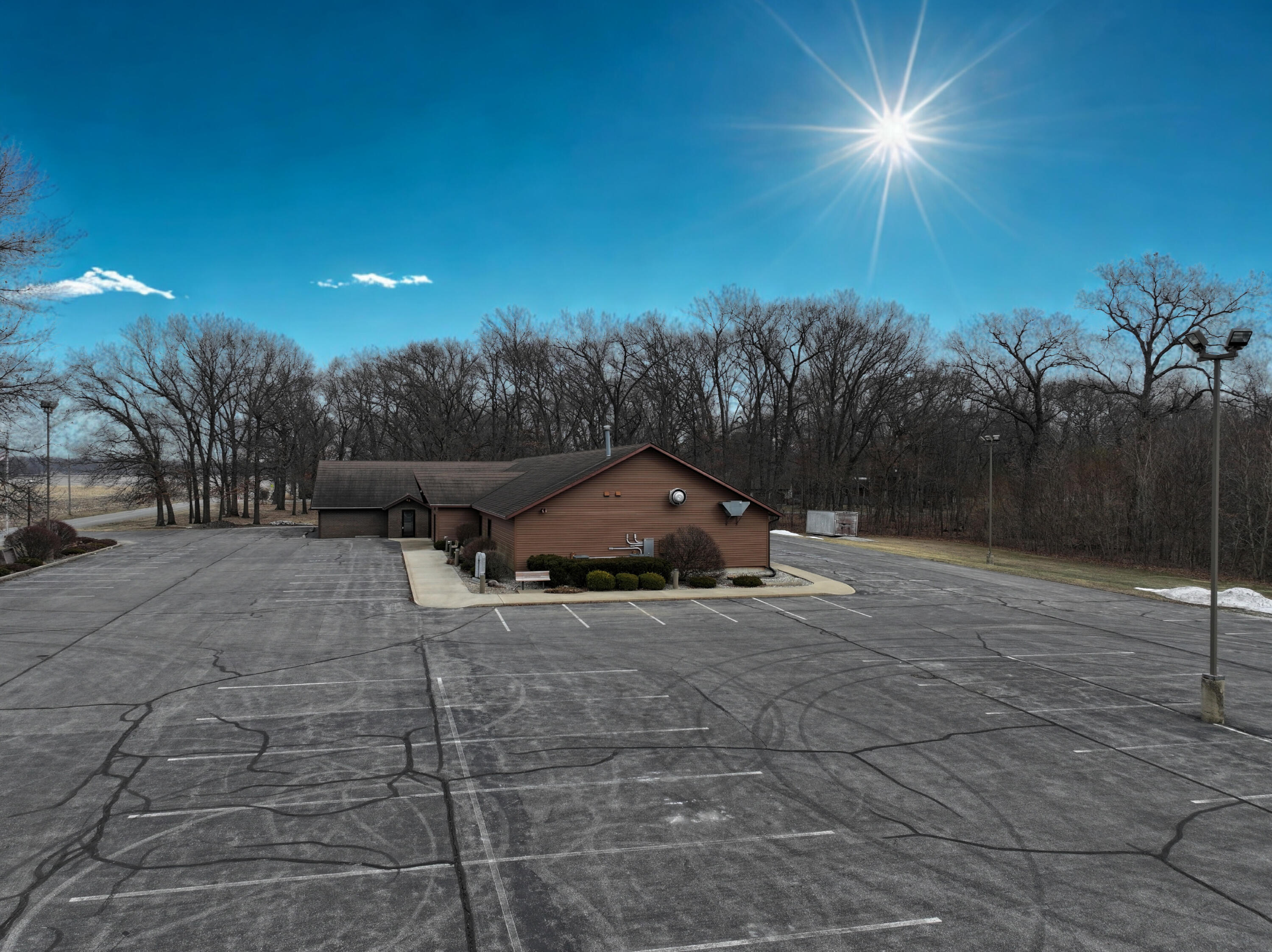 340 East 50 North Winamac, IN 46996 - Photo 12 of 38 a yellow house with trees in front of it
