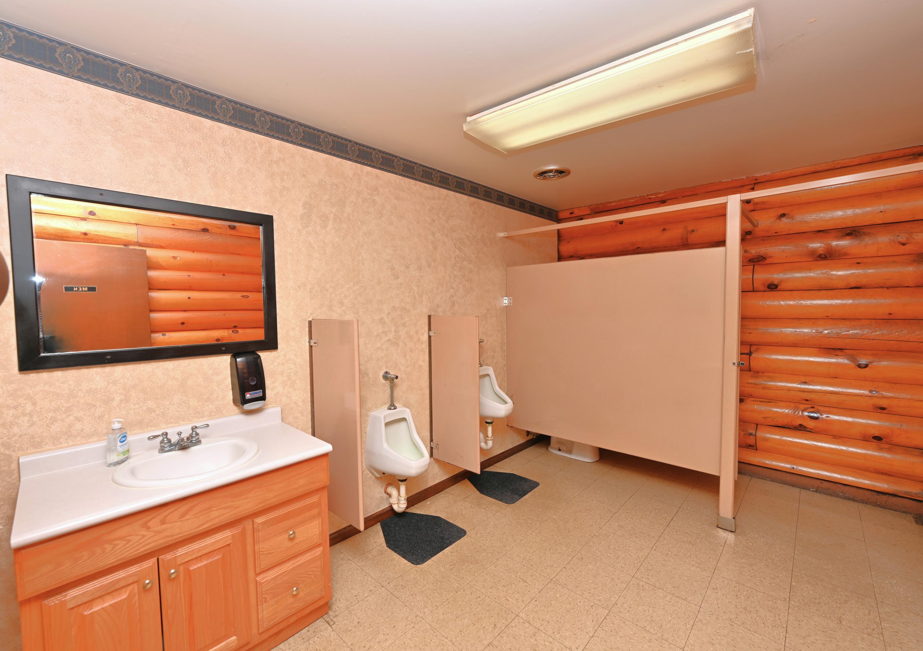 340 East 50 North Winamac, IN 46996 - Photo 23 of 38 a bathroom with a sink and a mirror