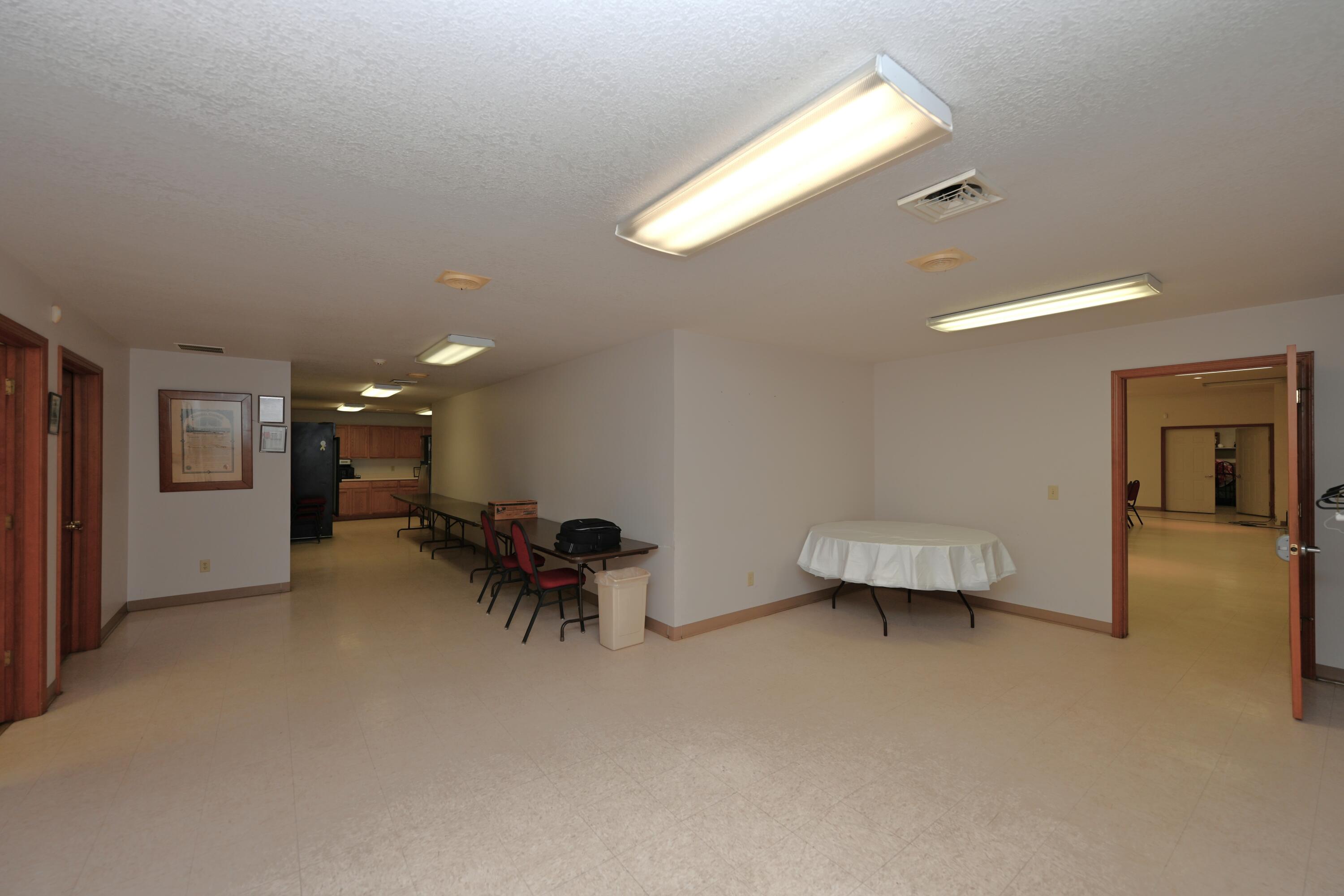 340 East 50 North Winamac, IN 46996 - Photo 38 of 38 a bedroom with furniture and a chandelier