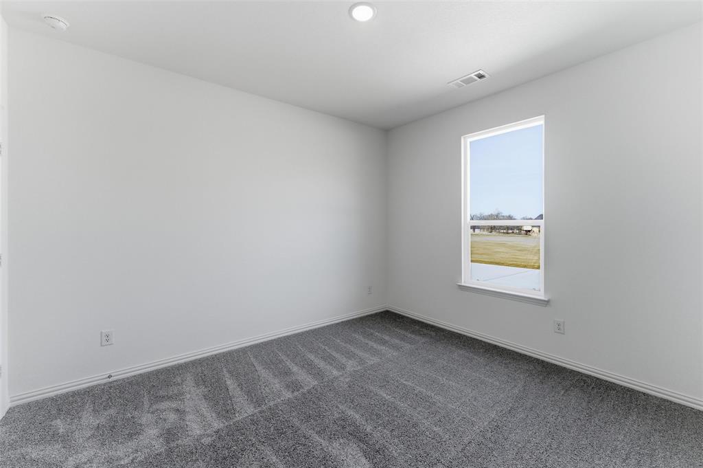 144 Oak Grv Way Springtown, TX 76082 - Photo 19 of 27 an empty room with a window