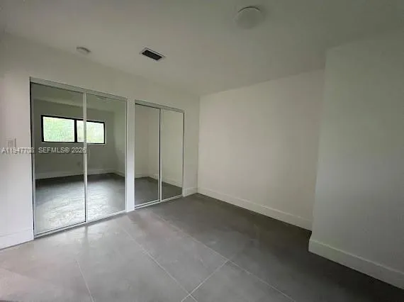 an empty room with a bathroom