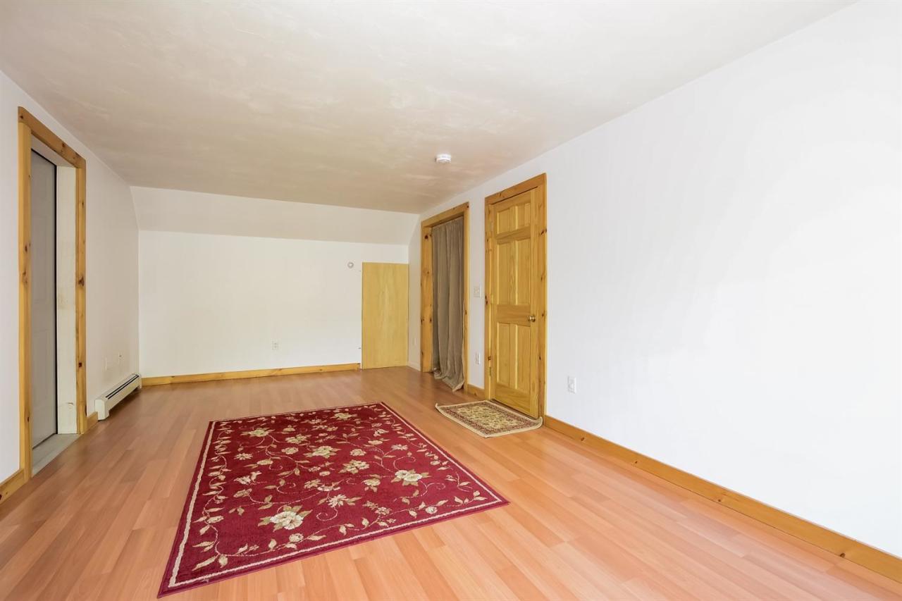 181 George Ryder Road Chatham, MA 02633 - Photo 15 of 24 a view of a room with wooden floor and tub