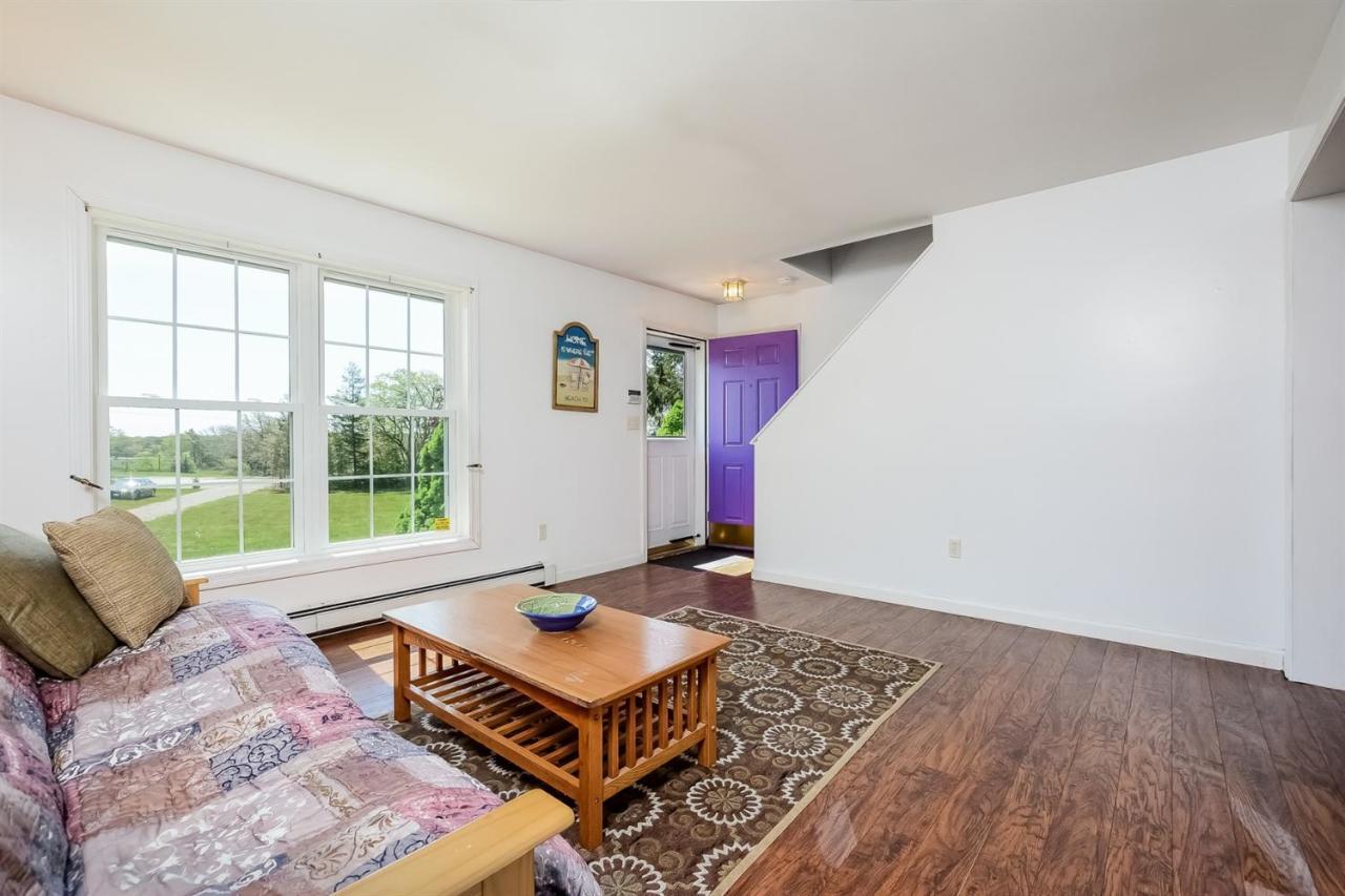 181 George Ryder Road Chatham, MA 02633 - Photo 4 of 24 a living room with furniture and a large window
