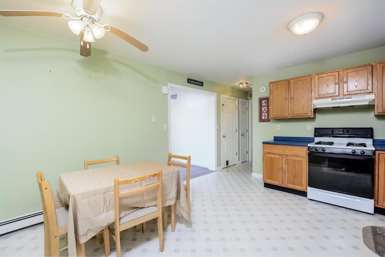 181 George Ryder Road Chatham, MA 02633 - Photo 7 of 24 a kitchen with a table and chairs