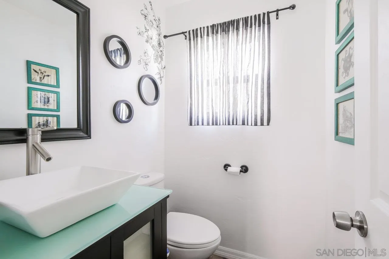 3726 Nassau Drive San Diego, CA 92115 - Photo 18 of 37 a bathroom with a toilet a sink and mirror