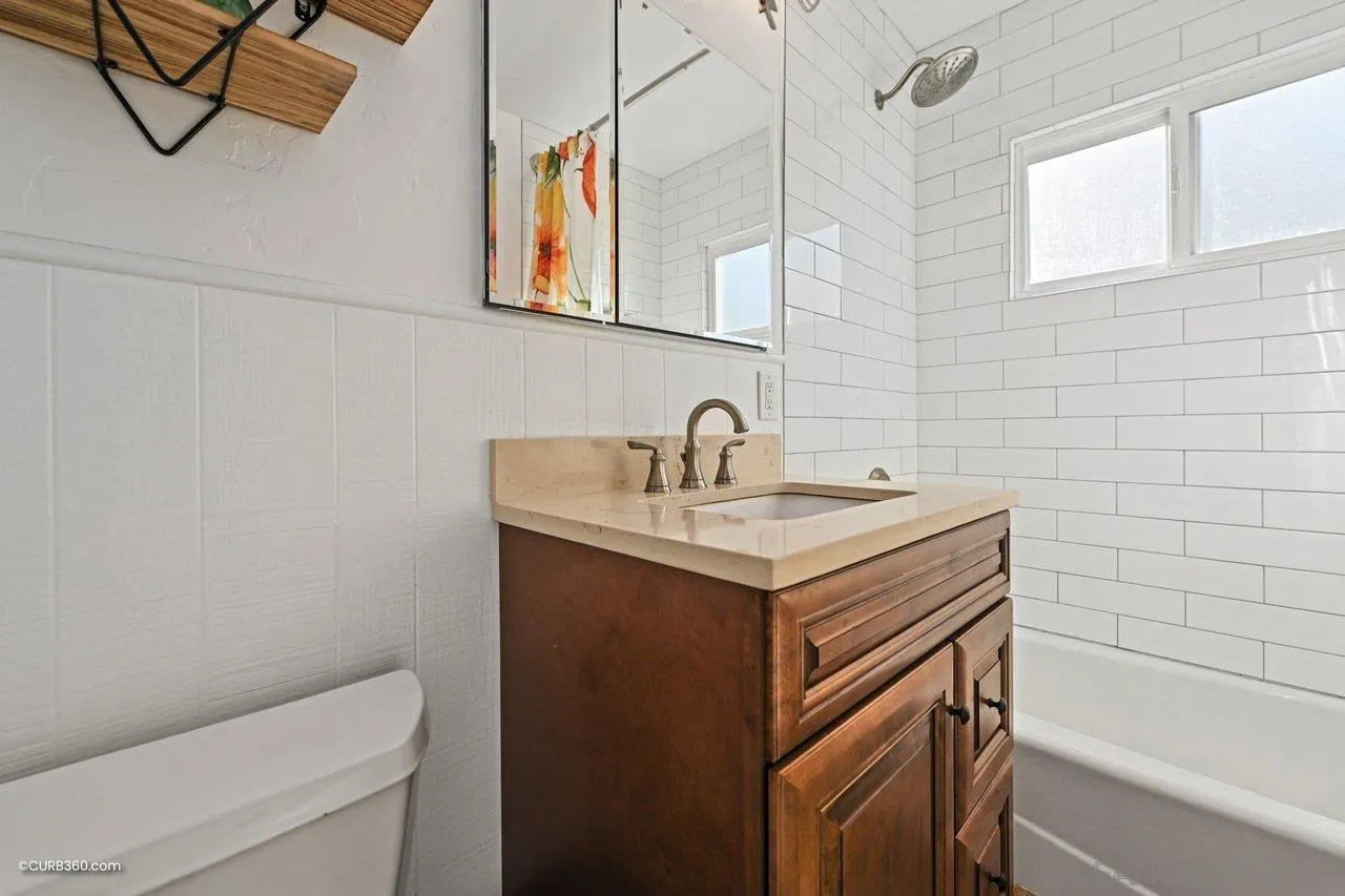 3726 Nassau Drive San Diego, CA 92115 - Photo 21 of 37 a bathroom with a sink a toilet and bathtub