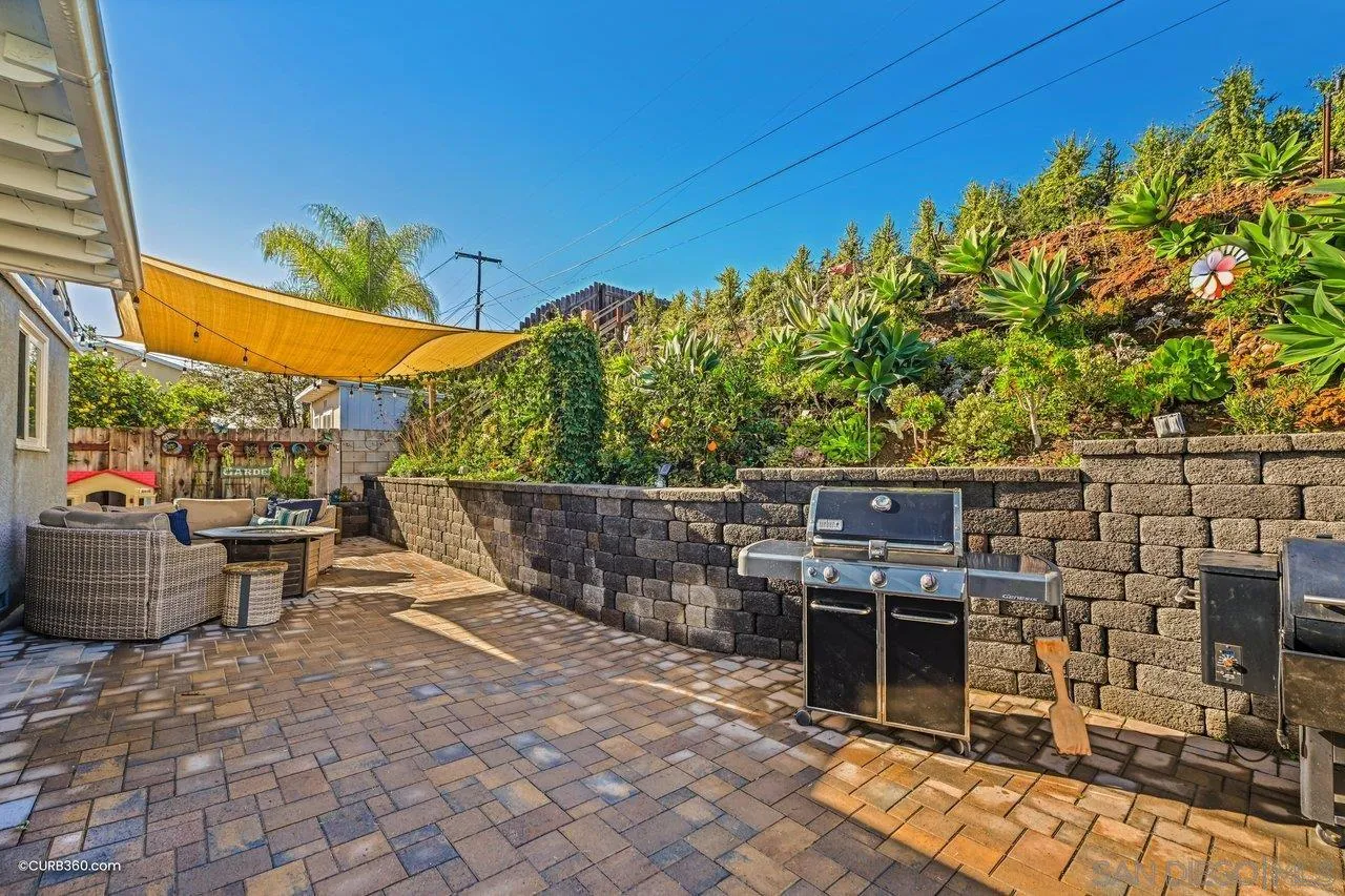 3726 Nassau Drive San Diego, CA 92115 - Photo 25 of 37 a view of a patio with table and chairs potted plants