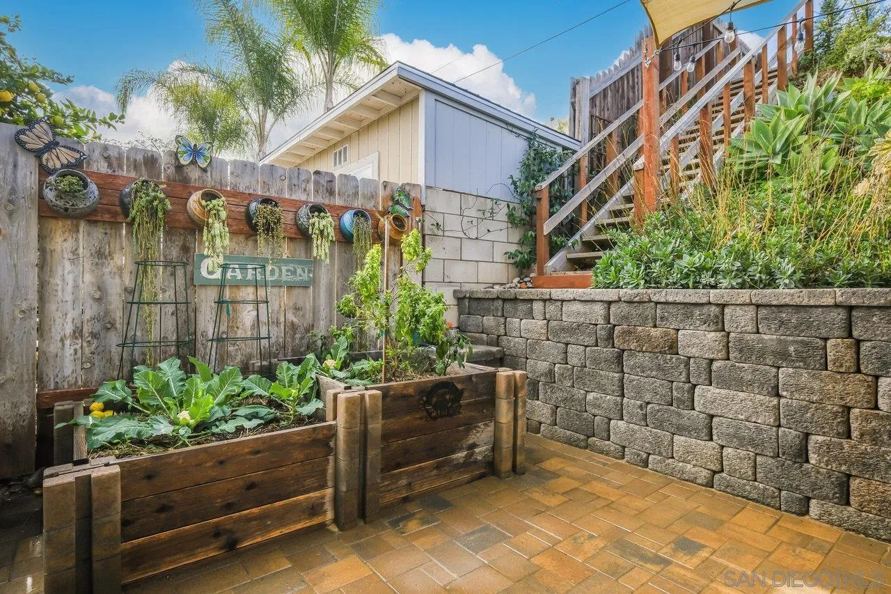 3726 Nassau Drive San Diego, CA 92115 - Photo 28 of 37 a view of a wooden door with a bench in patio