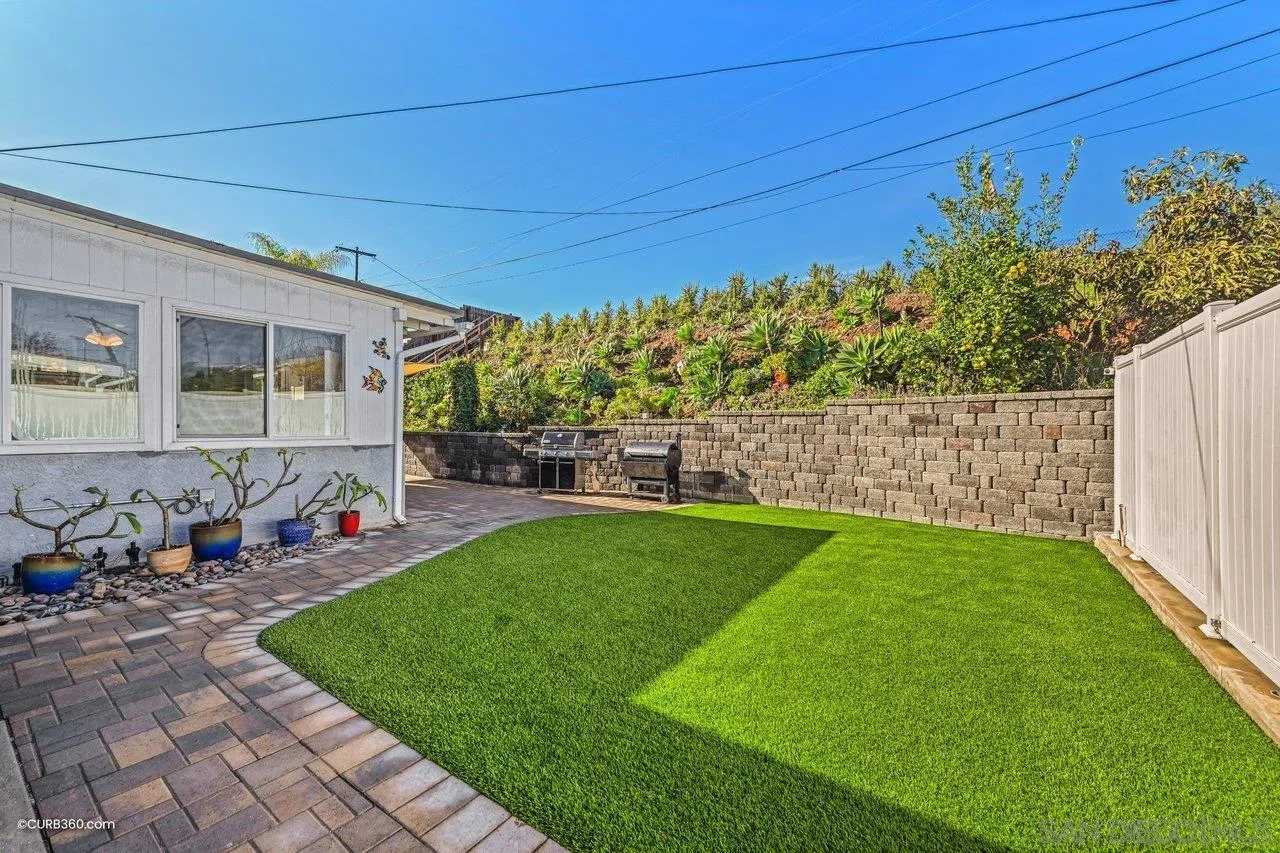 3726 Nassau Drive San Diego, CA 92115 - Photo 30 of 37 a view of a backyard with table and chairs and potted plants