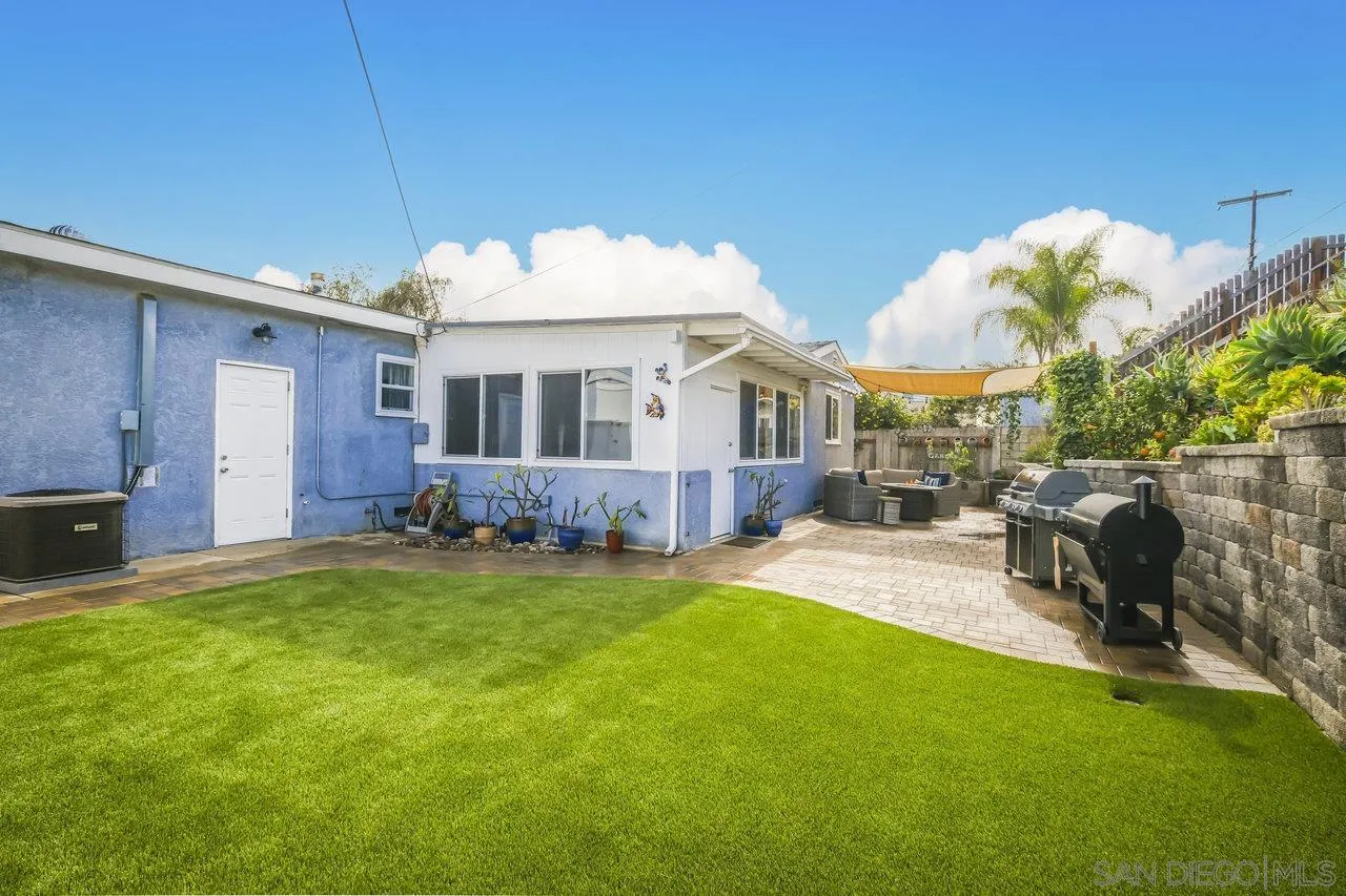 3726 Nassau Drive San Diego, CA 92115 - Photo 35 of 37 a view of a house with a patio and a yard