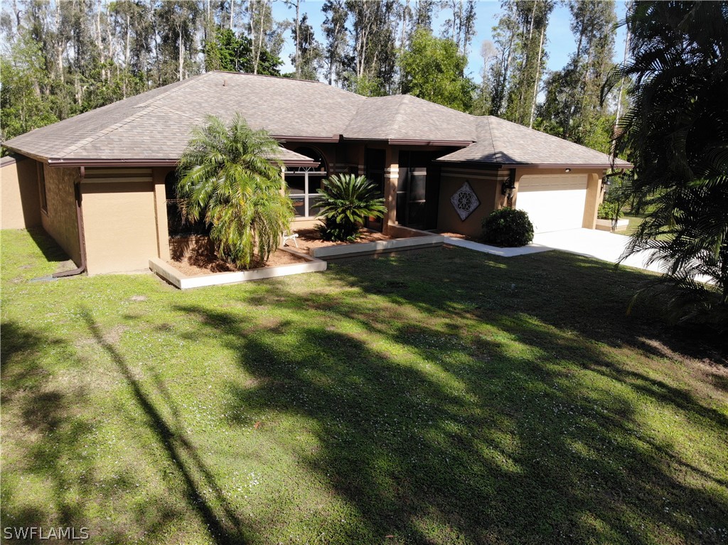 15252 Briar Ridge Circle Fort Myers, FL 33912 - Photo 1 of 25 a front view of a house with garden