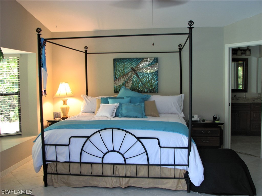 15252 Briar Ridge Circle Fort Myers, FL 33912 - Photo 11 of 25 a bedroom with a bed and window