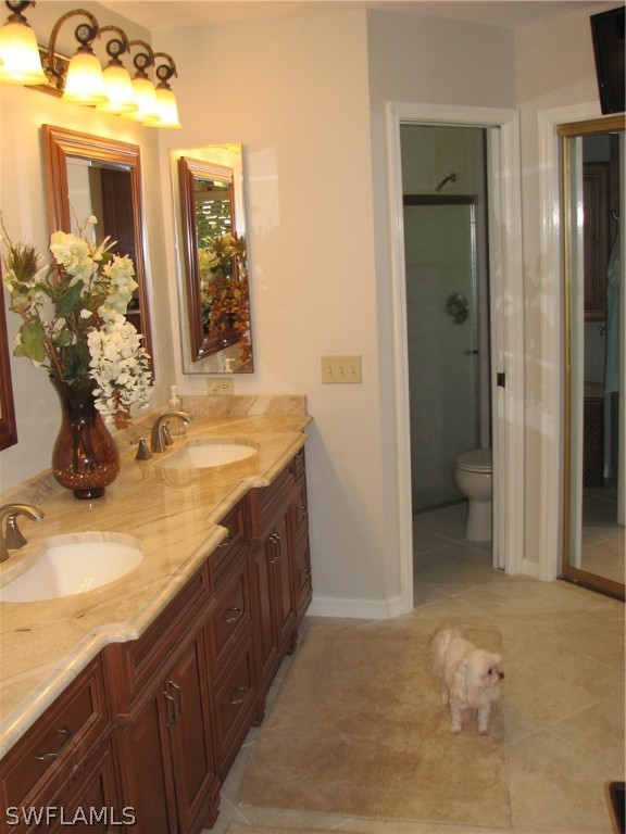 15252 Briar Ridge Circle Fort Myers, FL 33912 - Photo 15 of 25 a bathroom with mirror sink and vanity