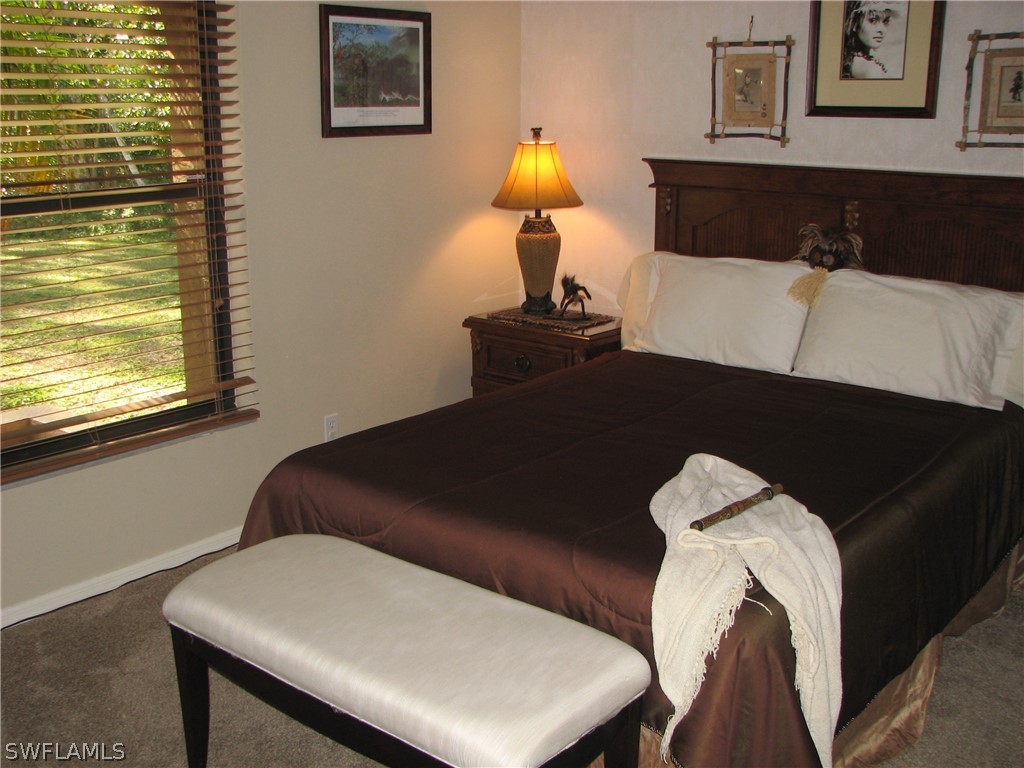 15252 Briar Ridge Circle Fort Myers, FL 33912 - Photo 19 of 25 a living room with furniture and a window