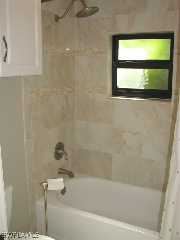 15252 Briar Ridge Circle Fort Myers, FL 33912 - Photo 22 of 25 a bathroom with a bathtub and a shower