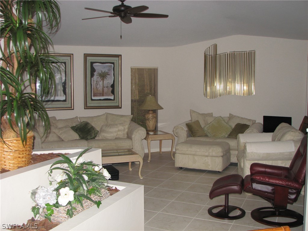 15252 Briar Ridge Circle Fort Myers, FL 33912 - Photo 23 of 25 a living room with furniture and a potted plant