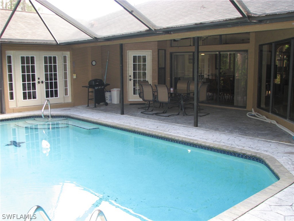 15252 Briar Ridge Circle Fort Myers, FL 33912 - Photo 24 of 25 a swimming pool with patio outdoor seating and yard