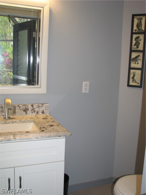 15252 Briar Ridge Circle Fort Myers, FL 33912 - Photo 25 of 25 a bathroom with a granite countertop sink and a mirror