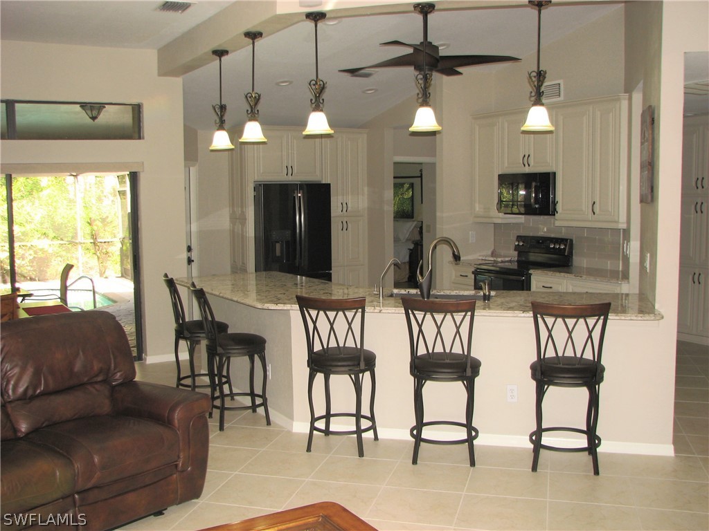 15252 Briar Ridge Circle Fort Myers, FL 33912 - Photo 4 of 25 a view of a livingroom with furniture window and wooden floor