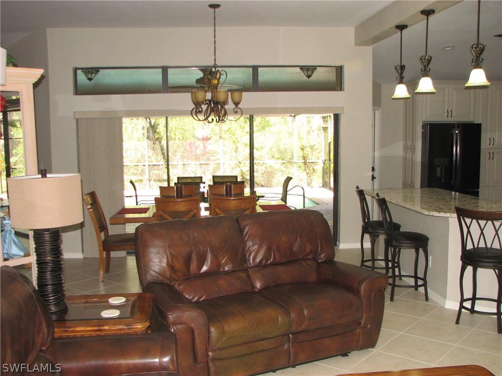 15252 Briar Ridge Circle Fort Myers, FL 33912 - Photo 5 of 25 a living room with furniture and a large window