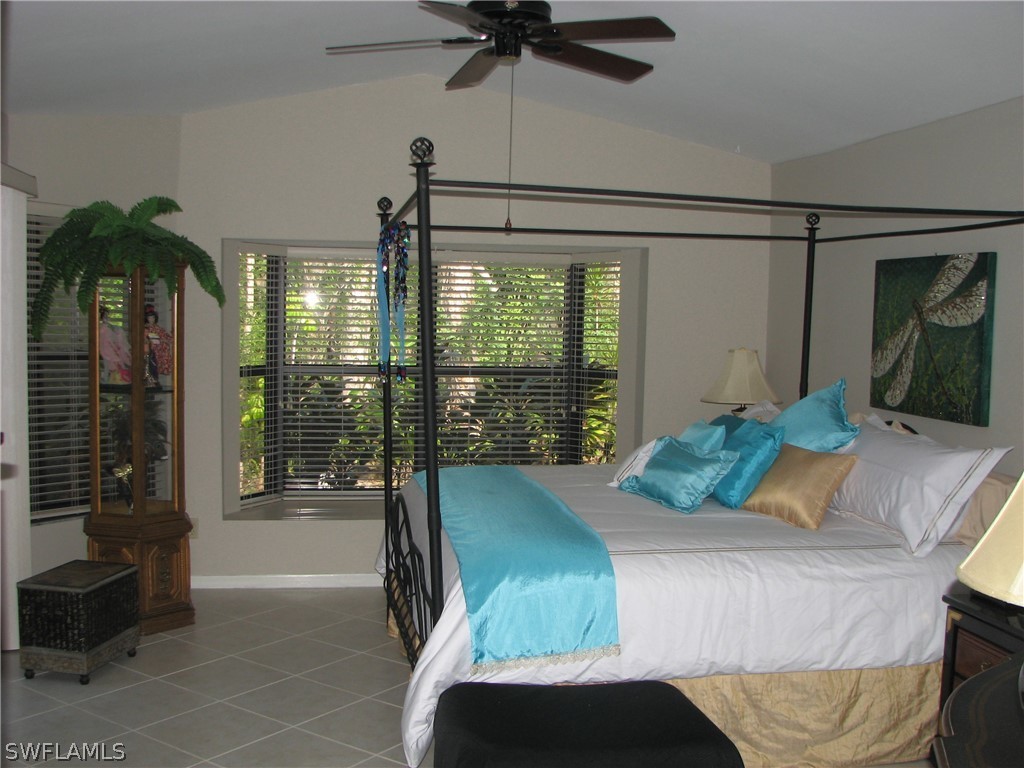 15252 Briar Ridge Circle Fort Myers, FL 33912 - Photo 10 of 25 a bedroom with a bed and a balcony