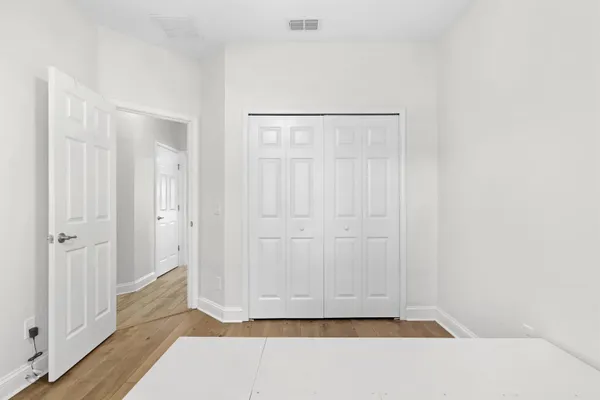 a view of a bathroom from a hallway